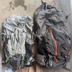 Two REI backpacking packs 50 and 65 L with the duck packs for water proofing